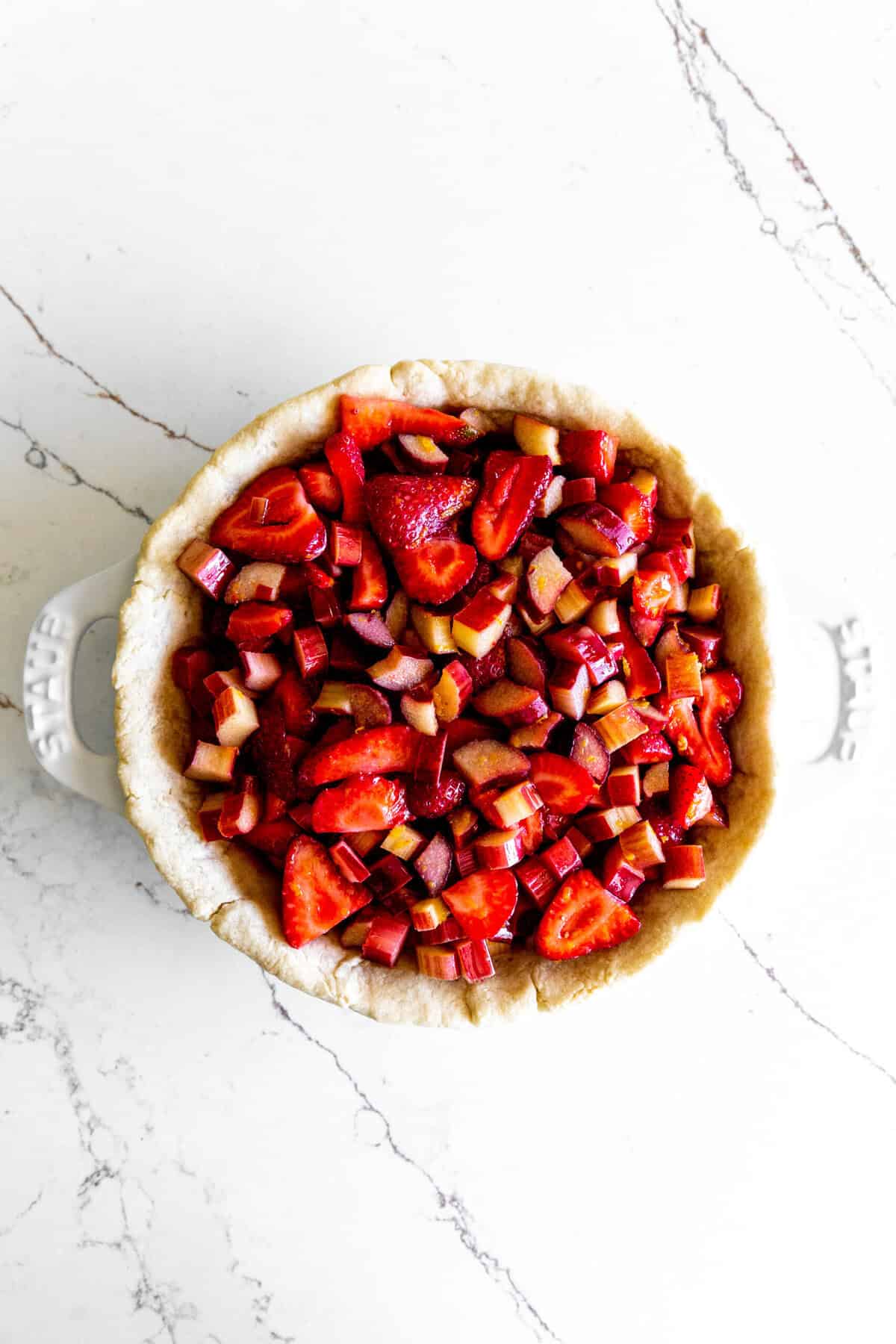 Strawberry rhubarb pie filling in a pie shell.