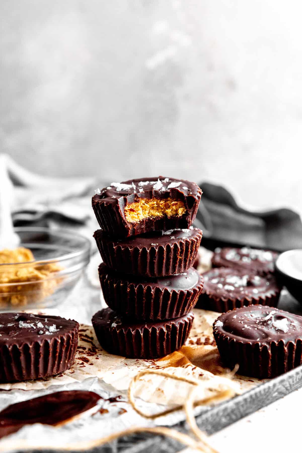 Stack of peanut butter cups on a baking sheet.