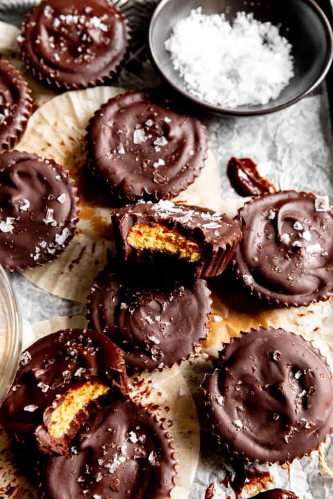Peanut butter cups and a bowl of flaky salt.