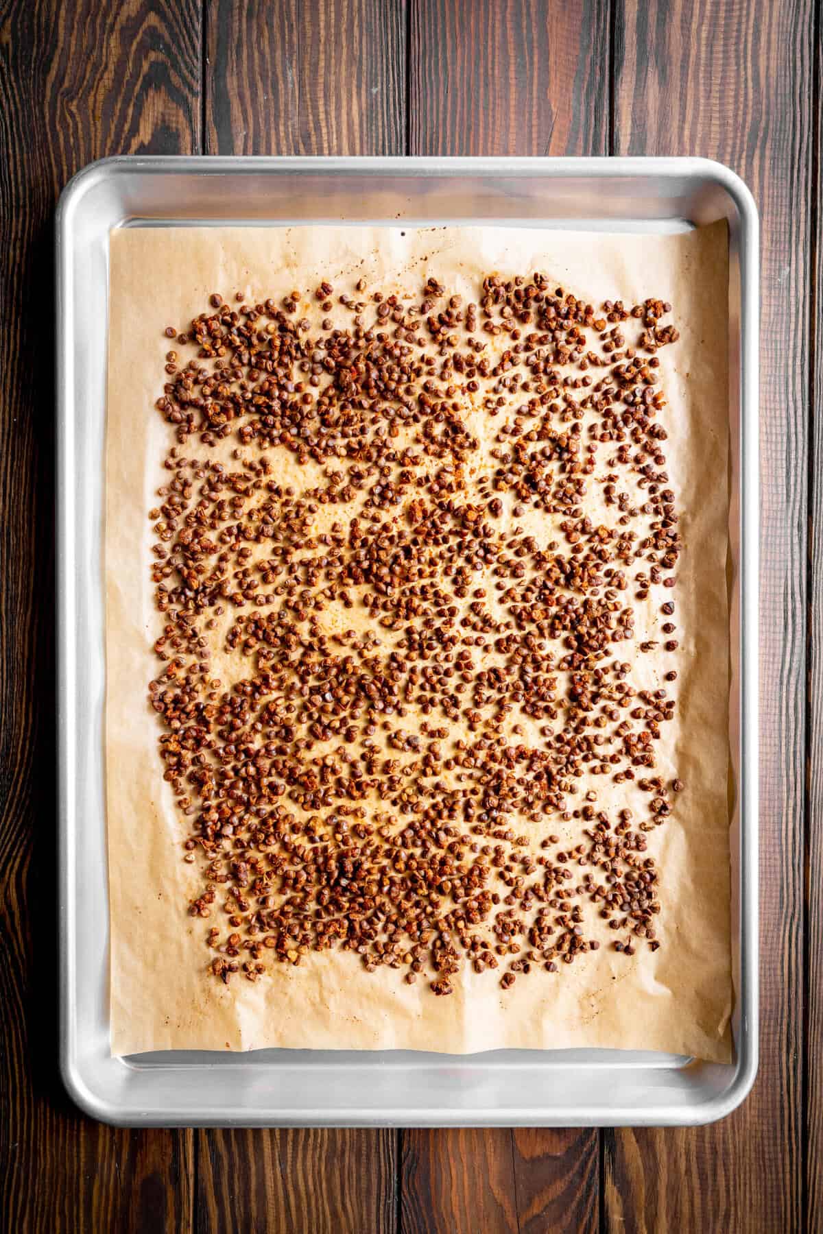 Roasted lentils on a baking sheet.