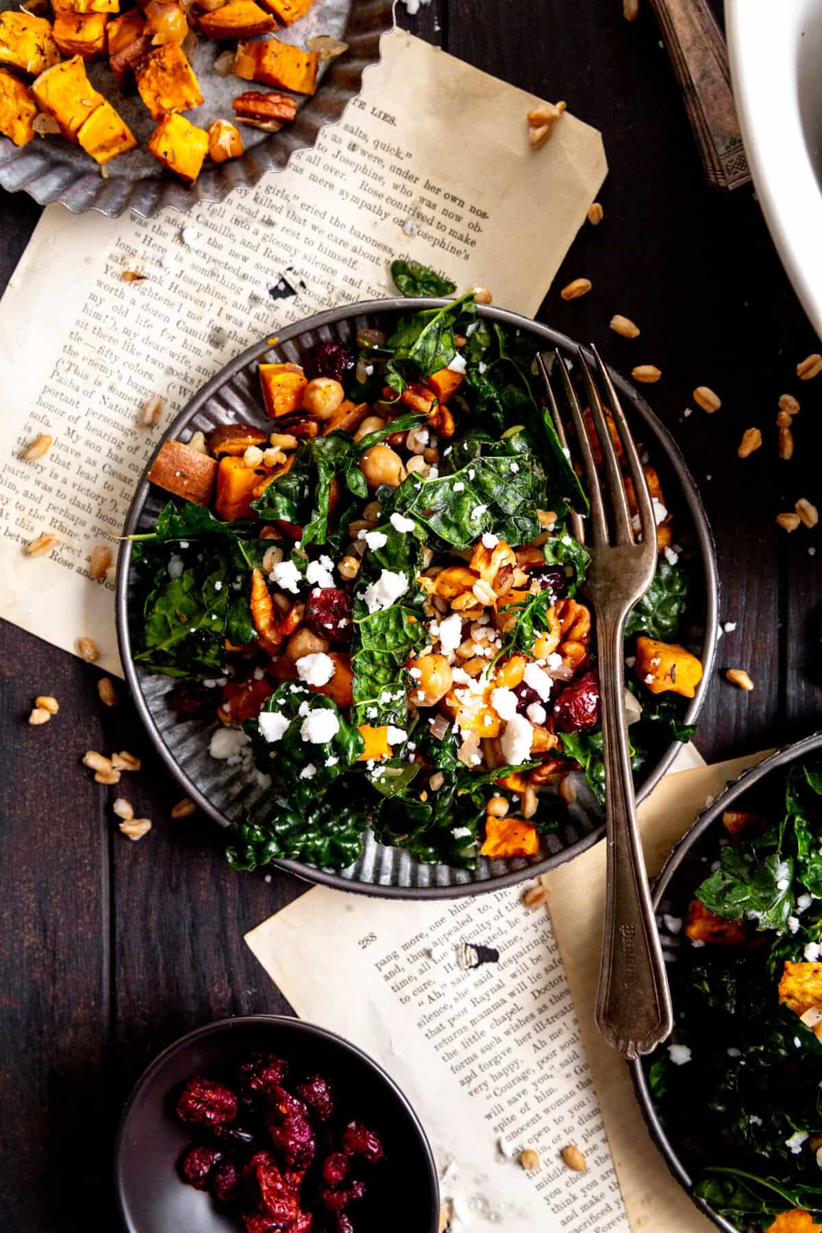 Fork digging into a kale salad.