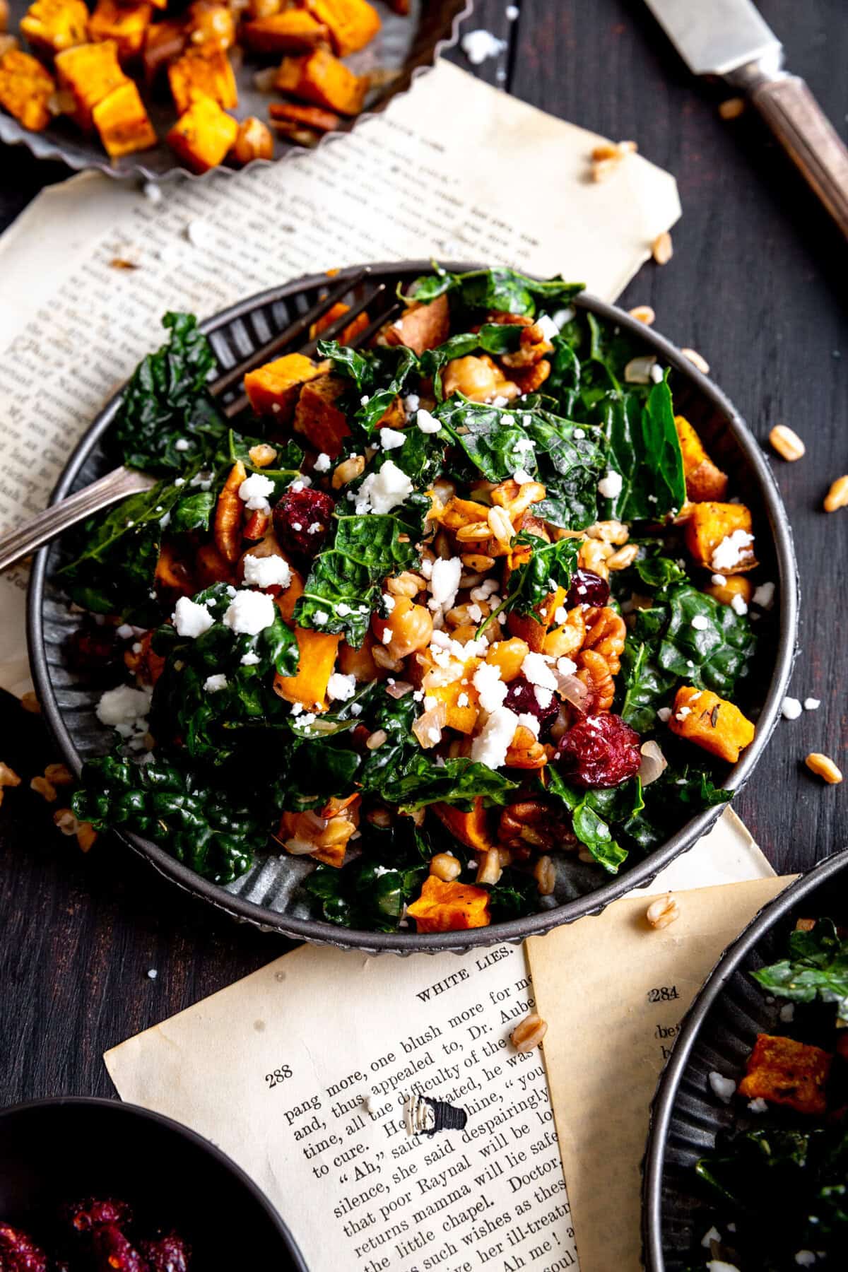 Kale salad topped with pecans and feta cheese.