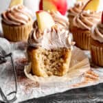Apple cinnamon cupcake with a bite taken out of it.