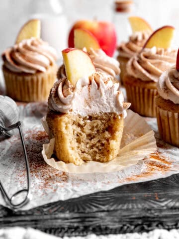 Apple cinnamon cupcake with a bite taken out of it.