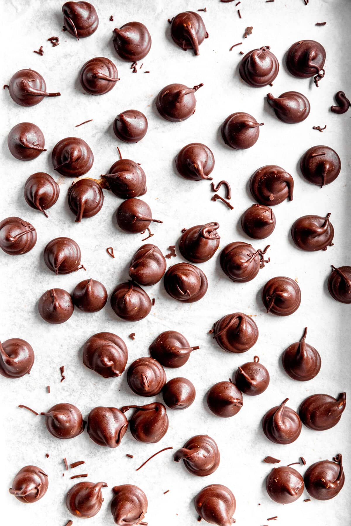 Vegan Hershey Kisses on a white surface.