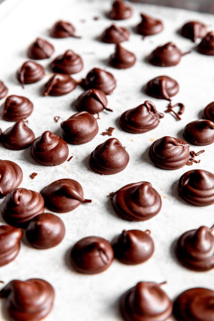 Close up of homemade Hershey Kisses on a baking sheet.