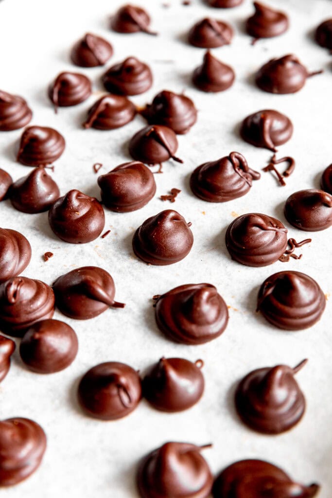 Close up of homemade Hershey Kisses on a baking sheet.
