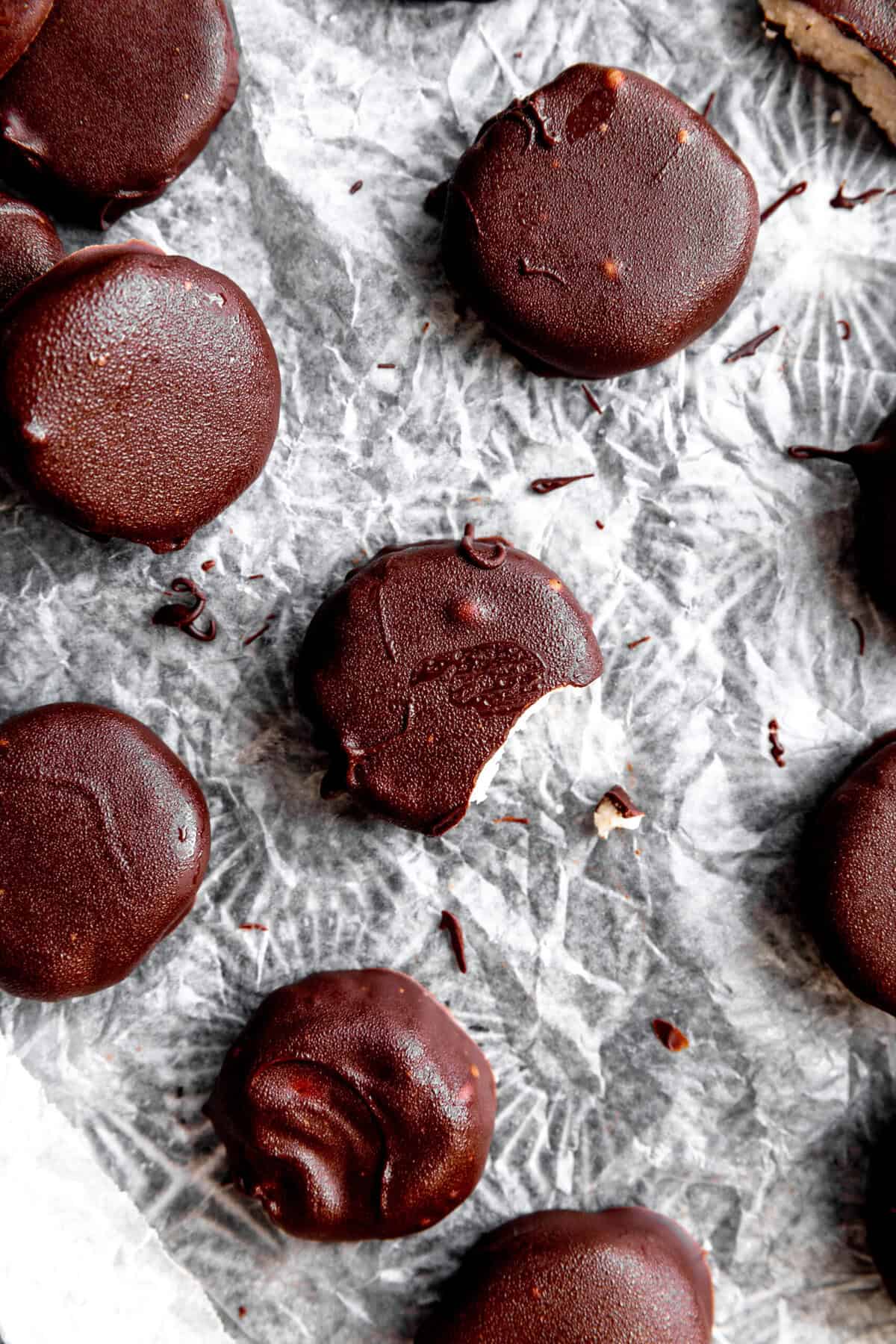 Peppermint patties on a baking sheet lined with wax paper.
