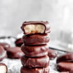 Stack of peppermint patties on a baking sheet.