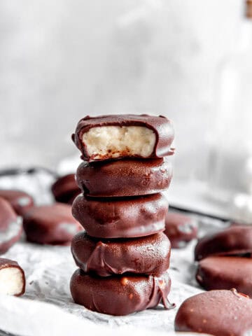 Stack of peppermint patties on a baking sheet.