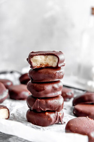 Stack of peppermint patties on a baking sheet.