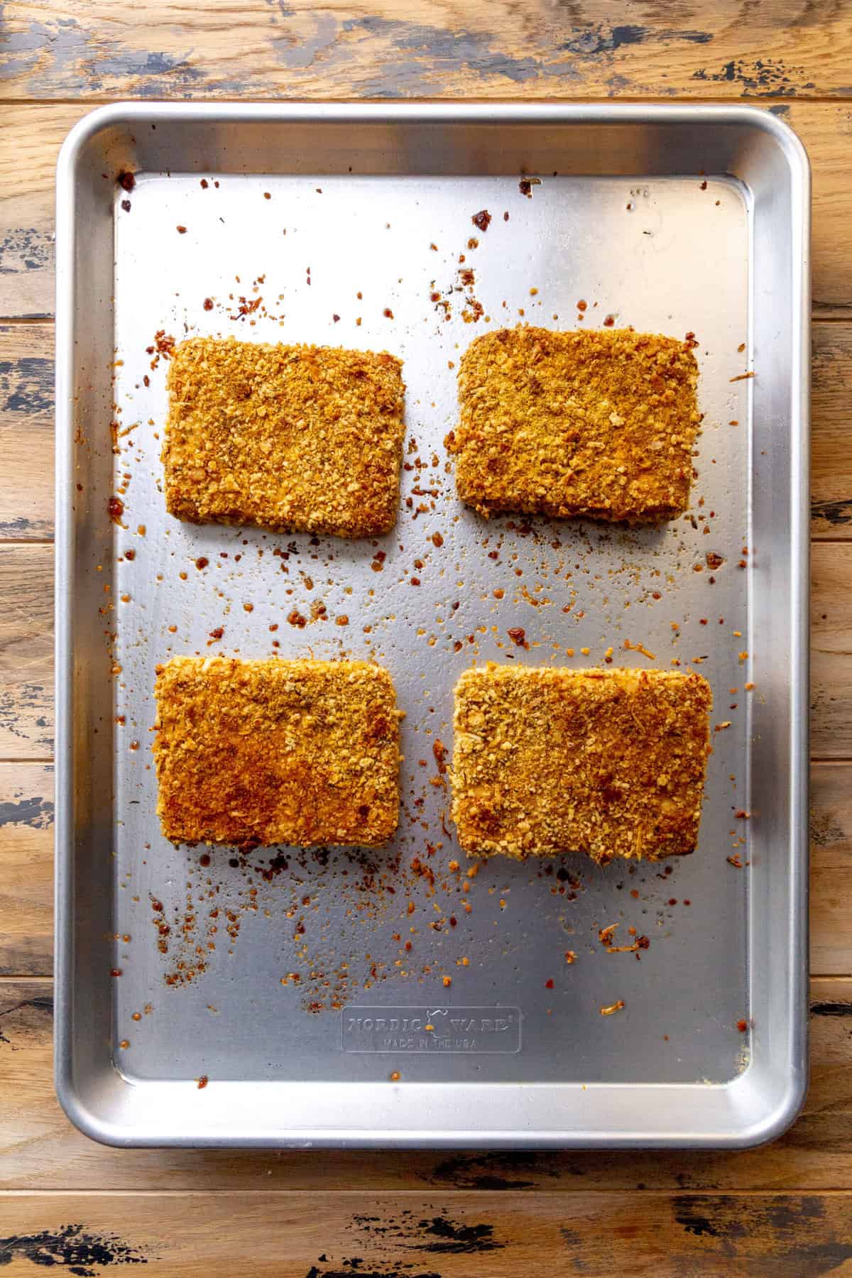 Baked tofu cutlets on a baking sheet.