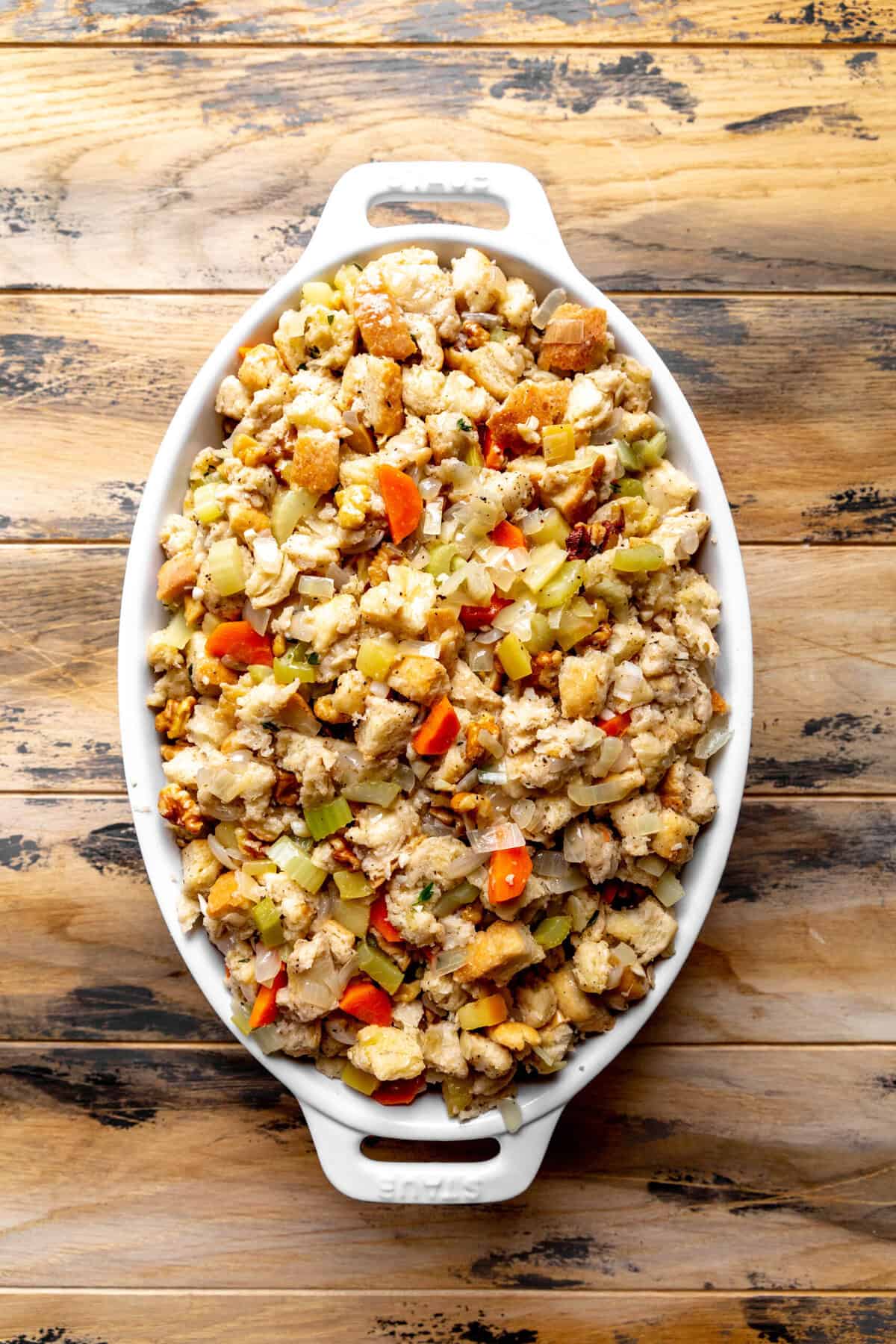 Unbaked vegan stuffing in a casserole dish.