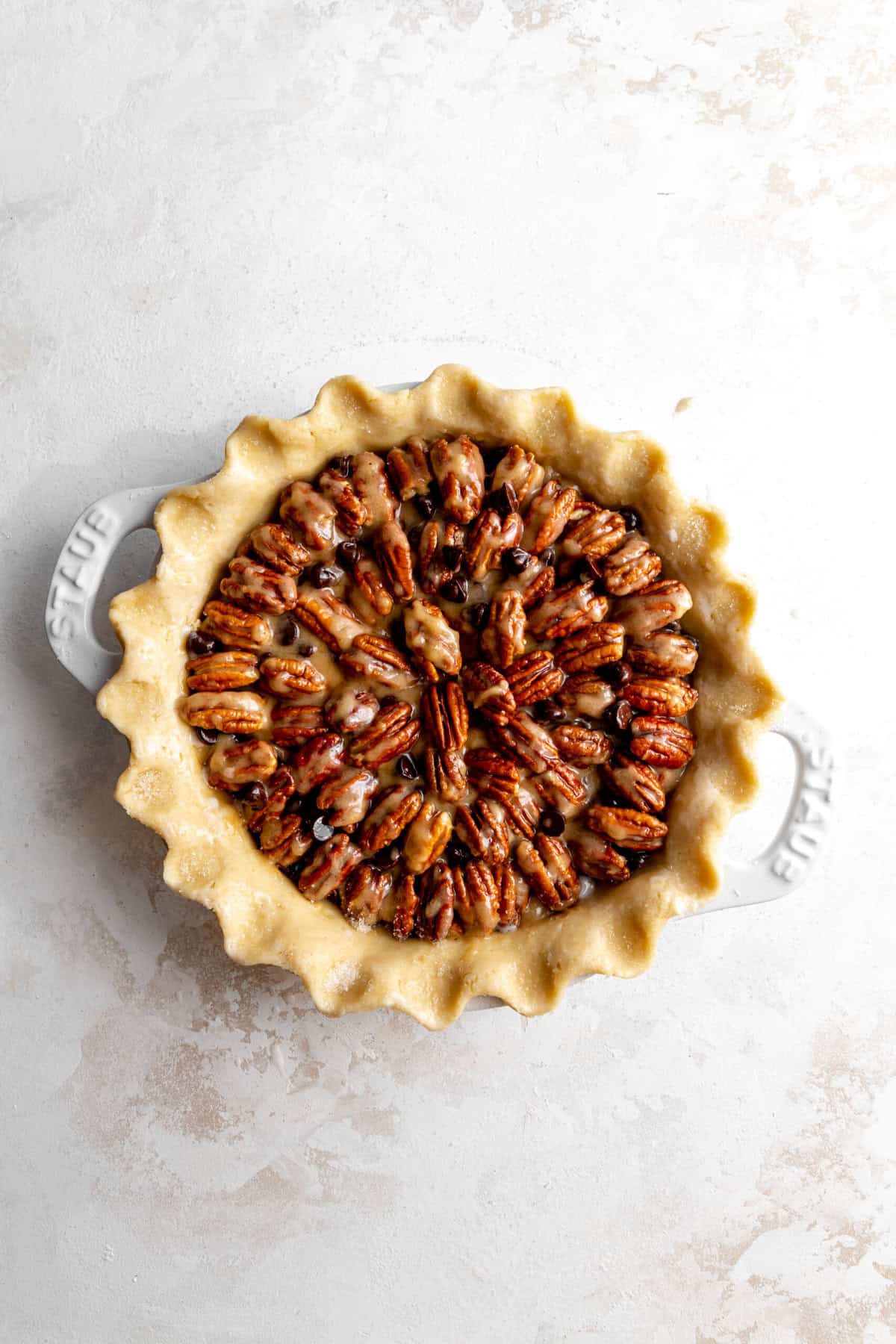 Unbaked chocolate bourbon pecan pie.