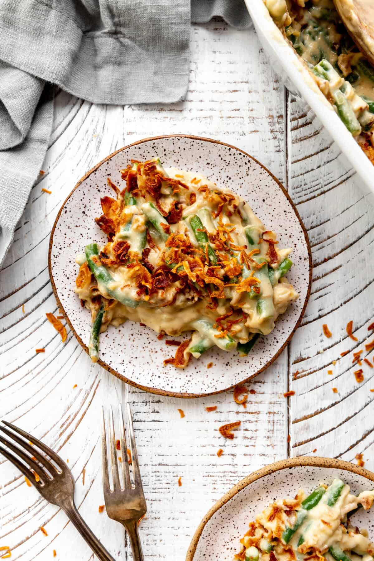 Plate of green bean casserole and a linen napkin.
