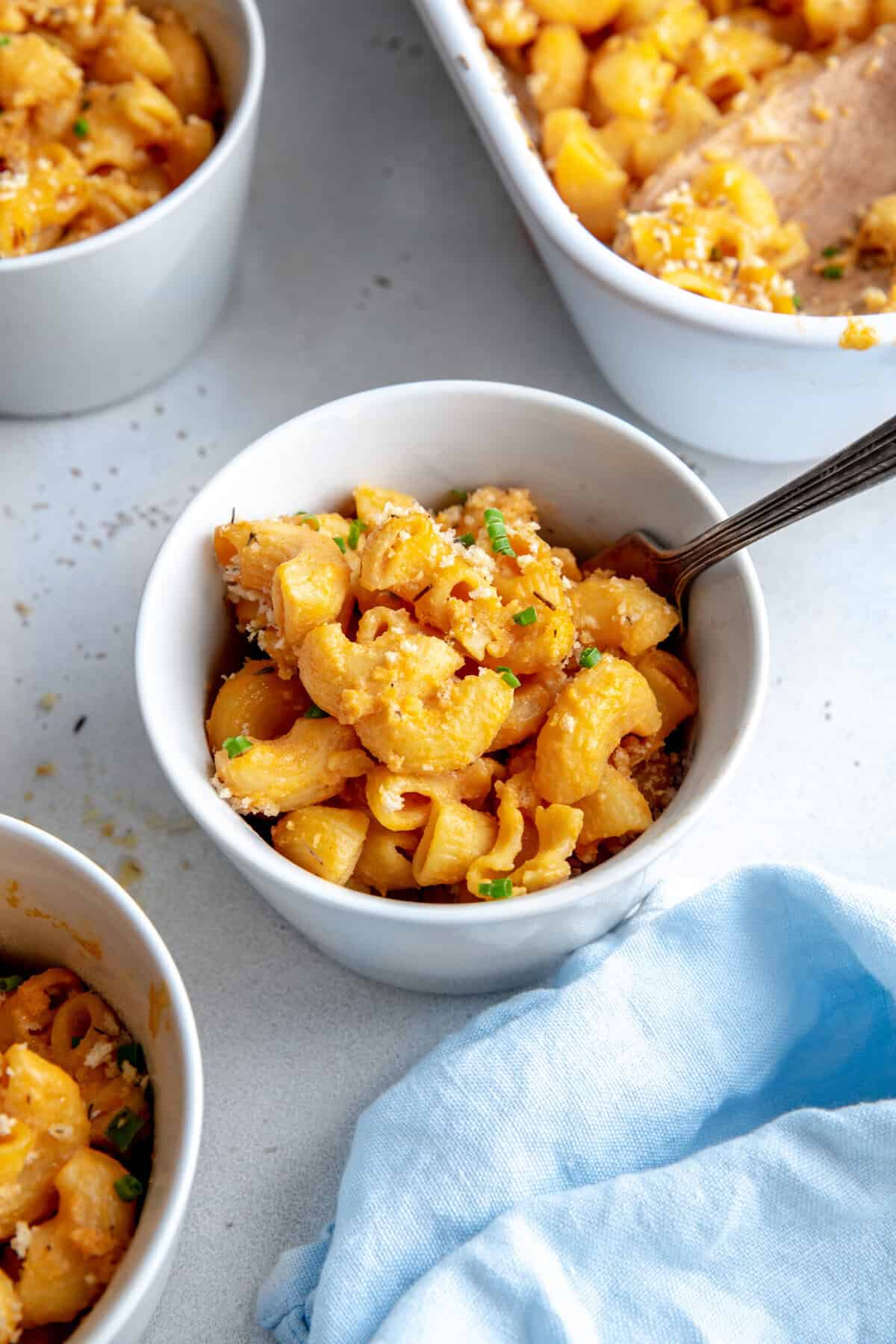 Small bowl of mac and cheese with a fork.