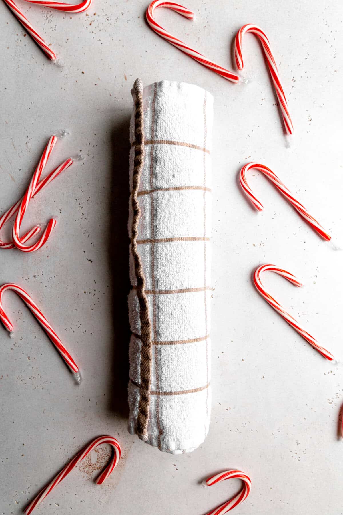 Chocolate cake rolled up in a towel.