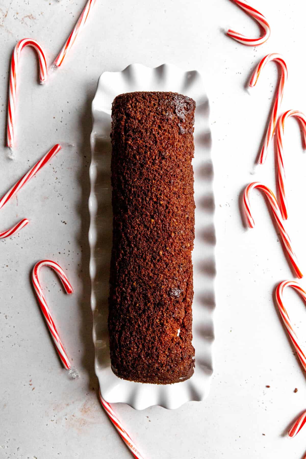 Rolled and unfrosted chocolate yule log.
