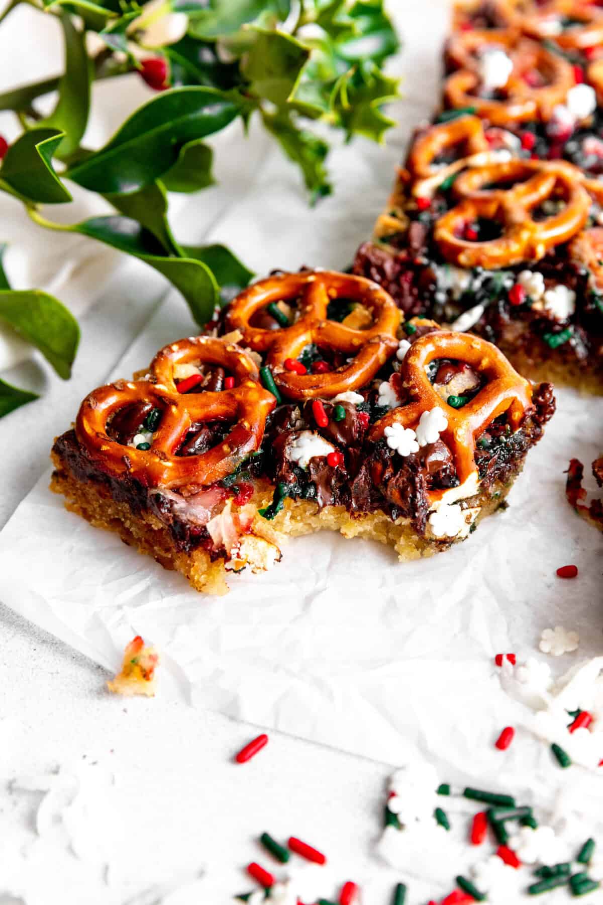 Christmas 7 layer bar with a bite taken out of it.