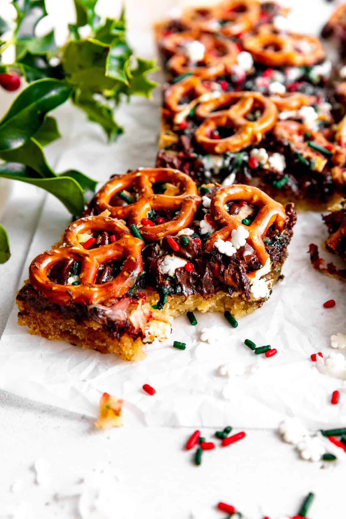 Christmas 7 layer bar with a bite taken out of it.