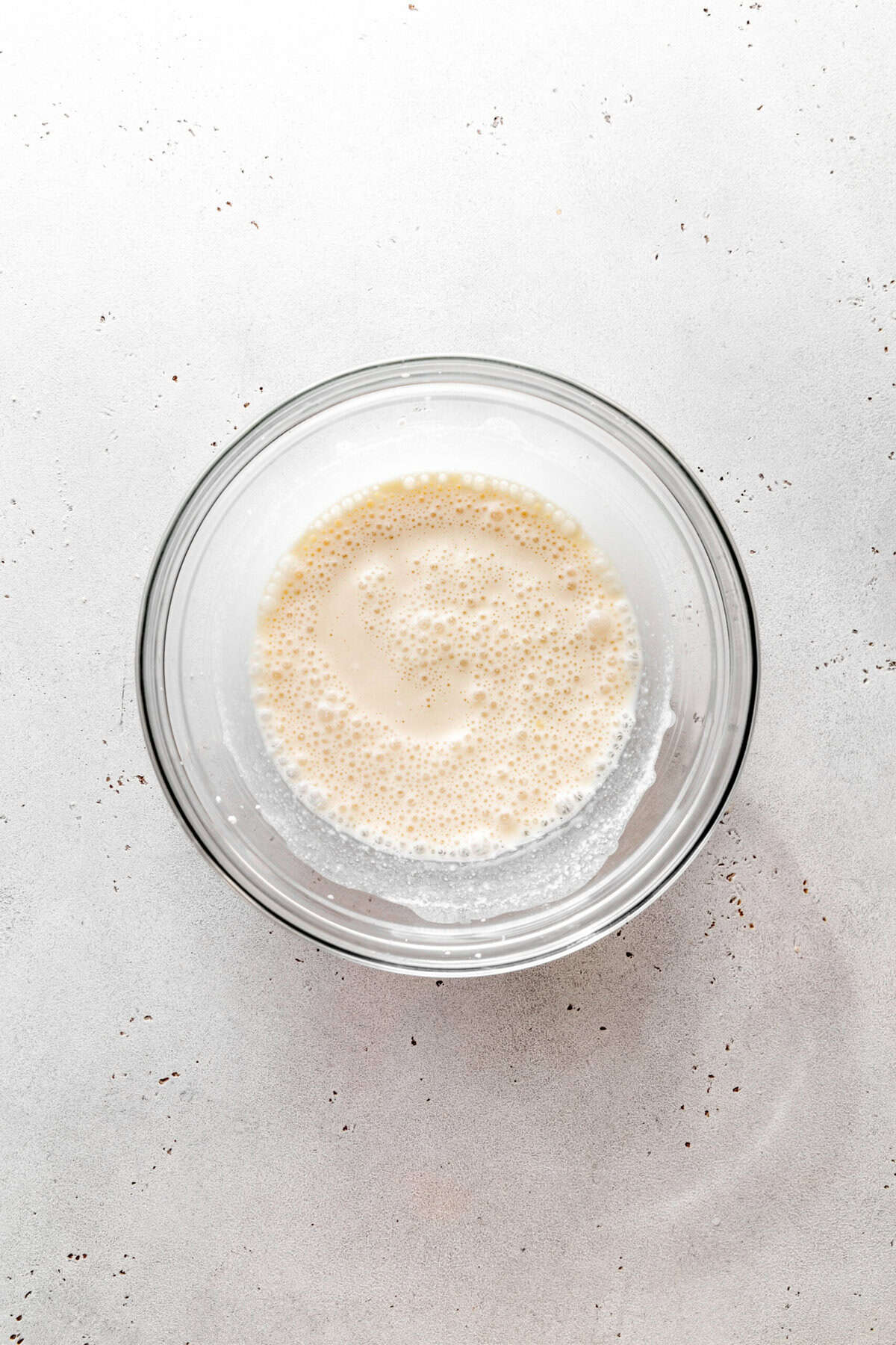 Coconut milk in a glass bowl.