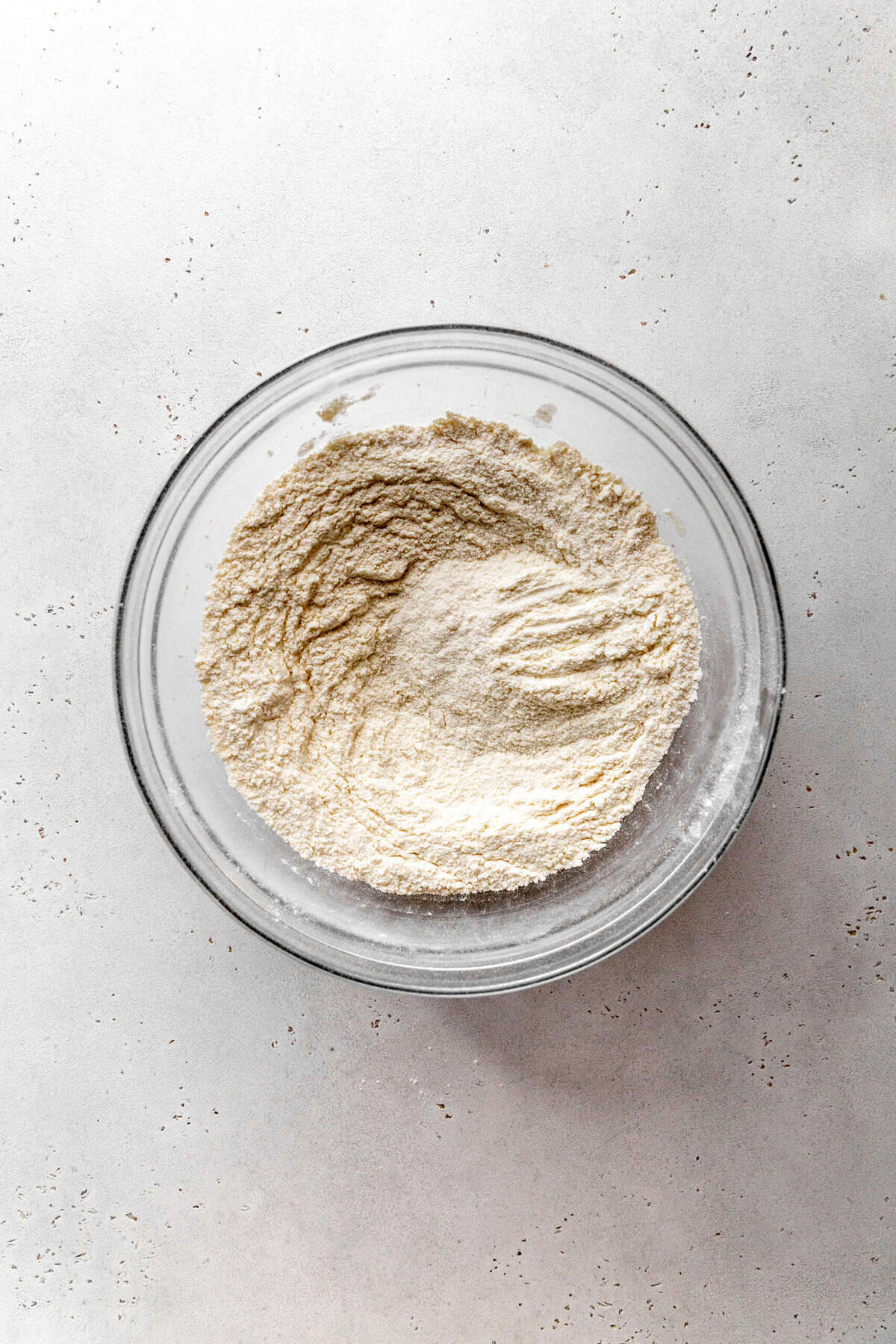 Glass bowl of flour and sugar.