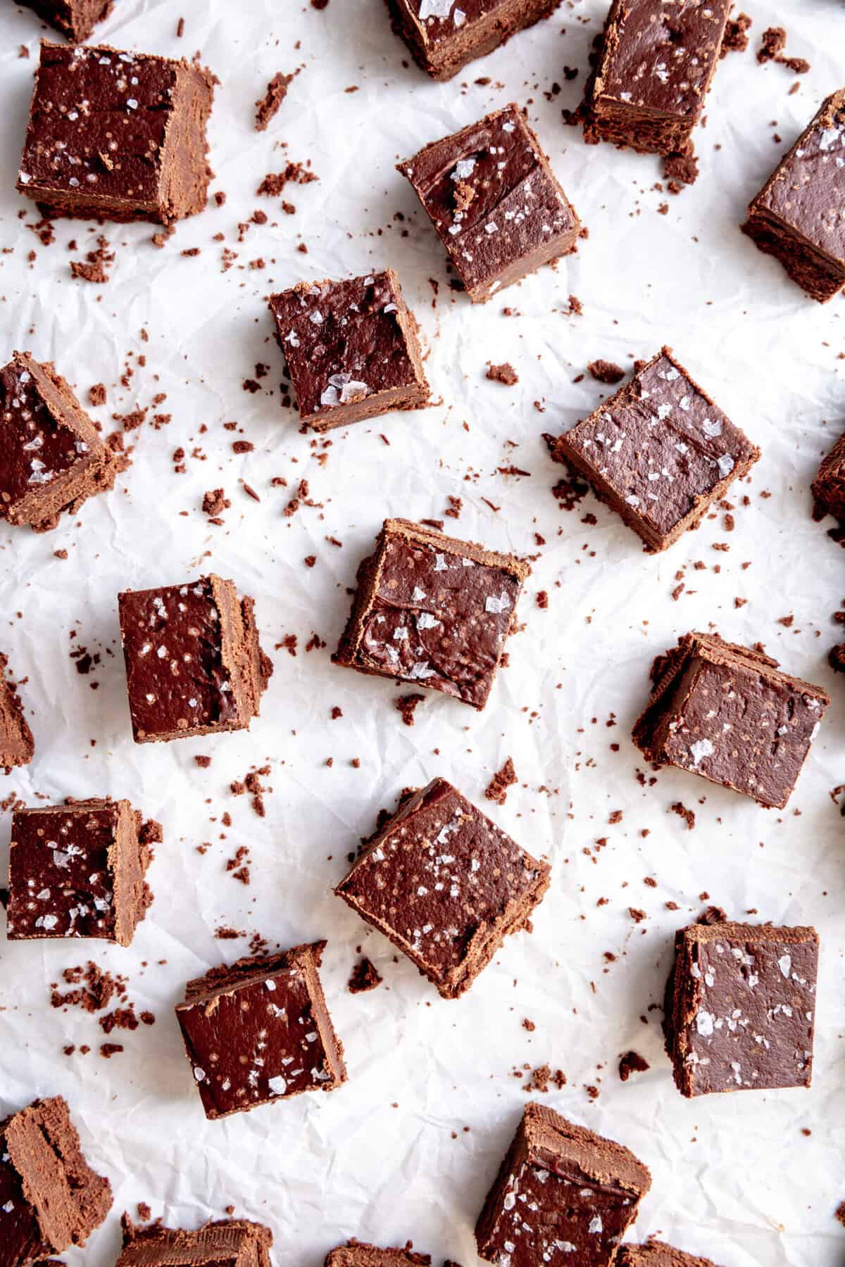 Pieces of fudge laid out on a white surface.