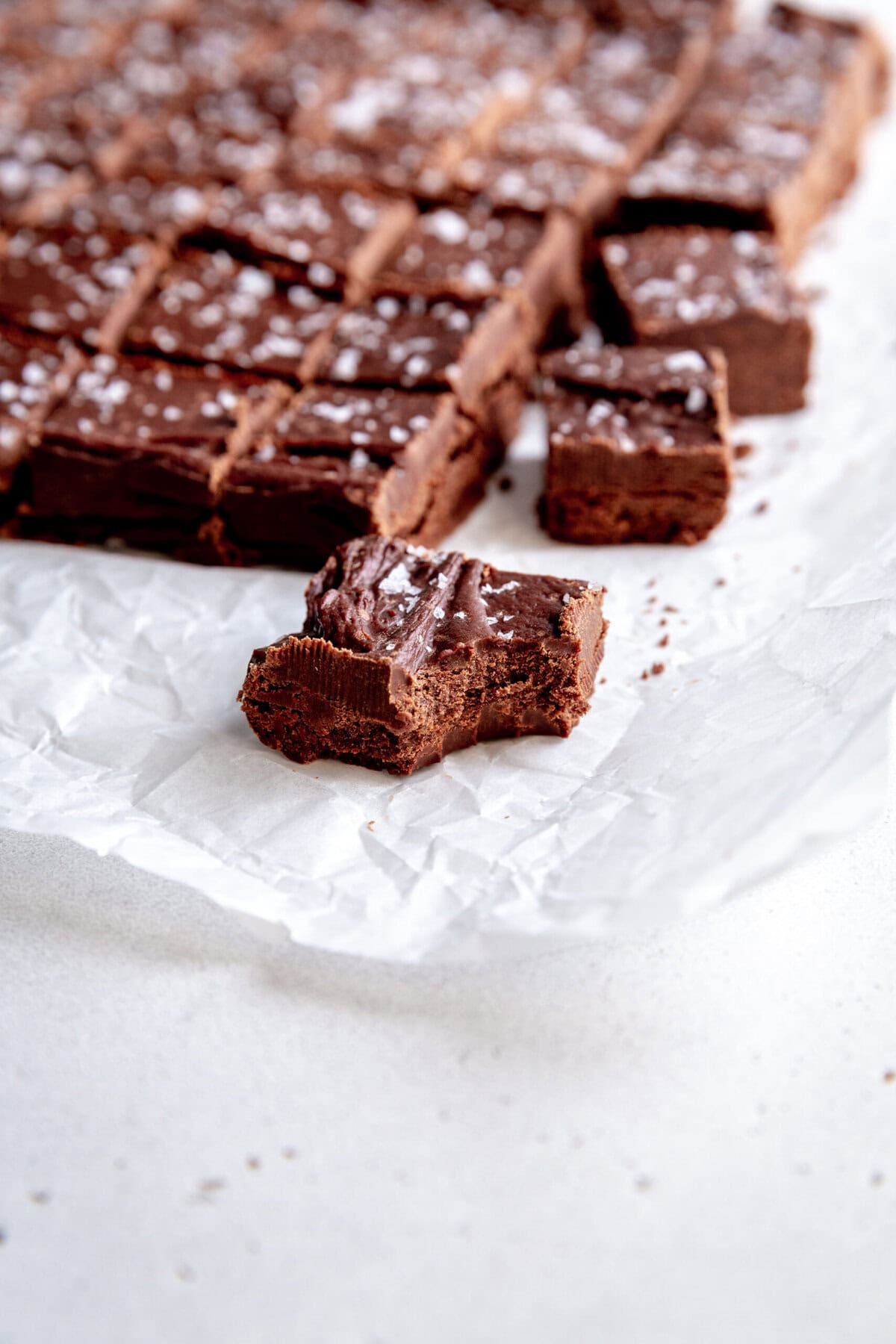 Piece of fudge with a bite taken out of it.