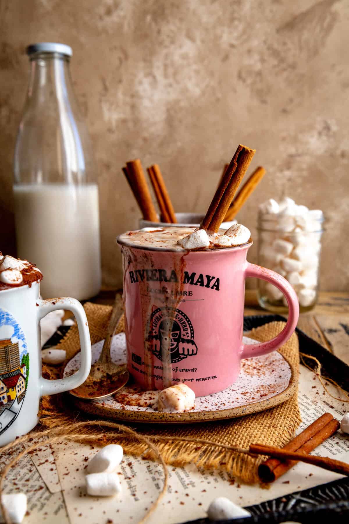 Mug of Mexican hot chocolate with hot chocolate dripping down the sides.