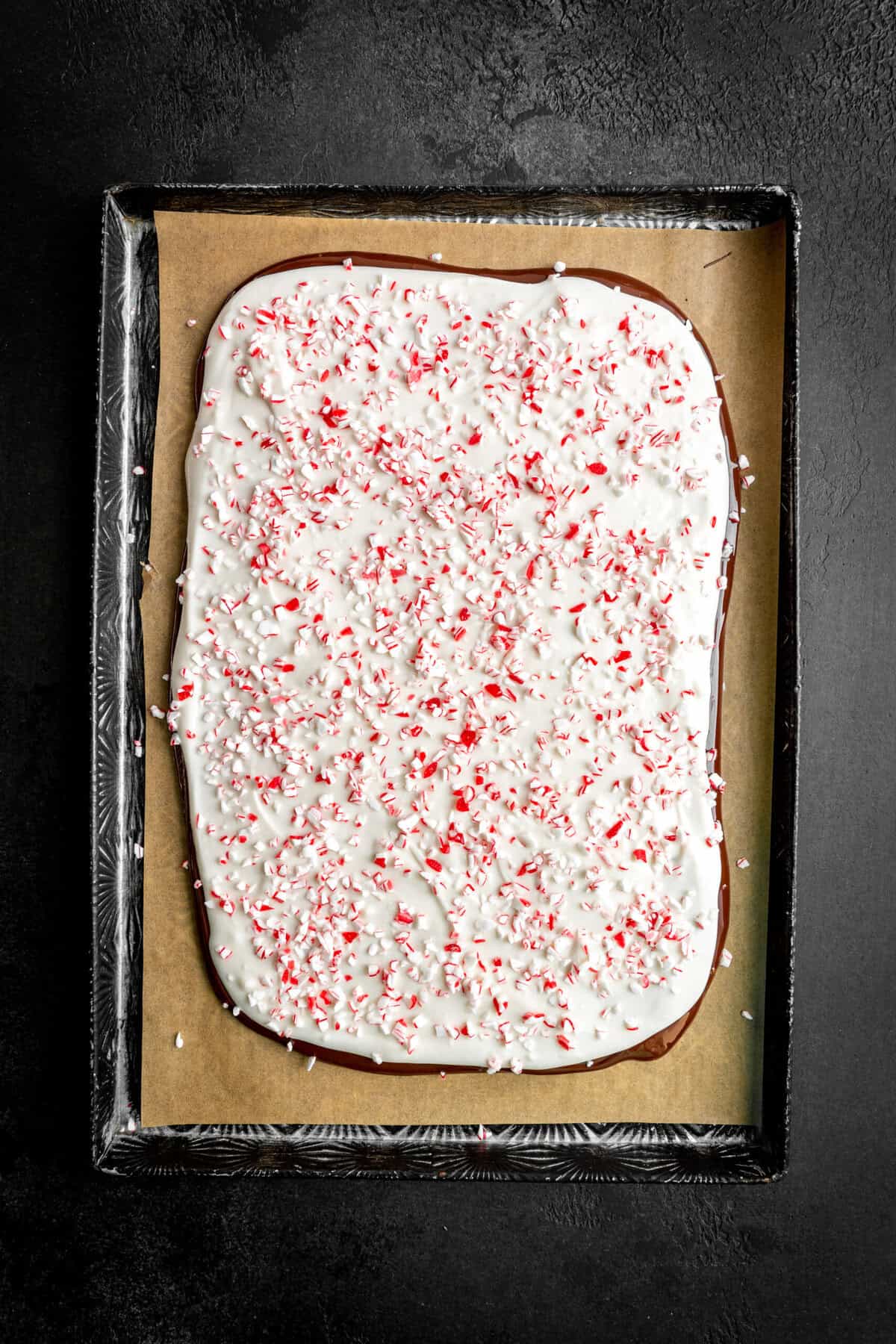 Unset vegan peppermint bark on a baking sheet.