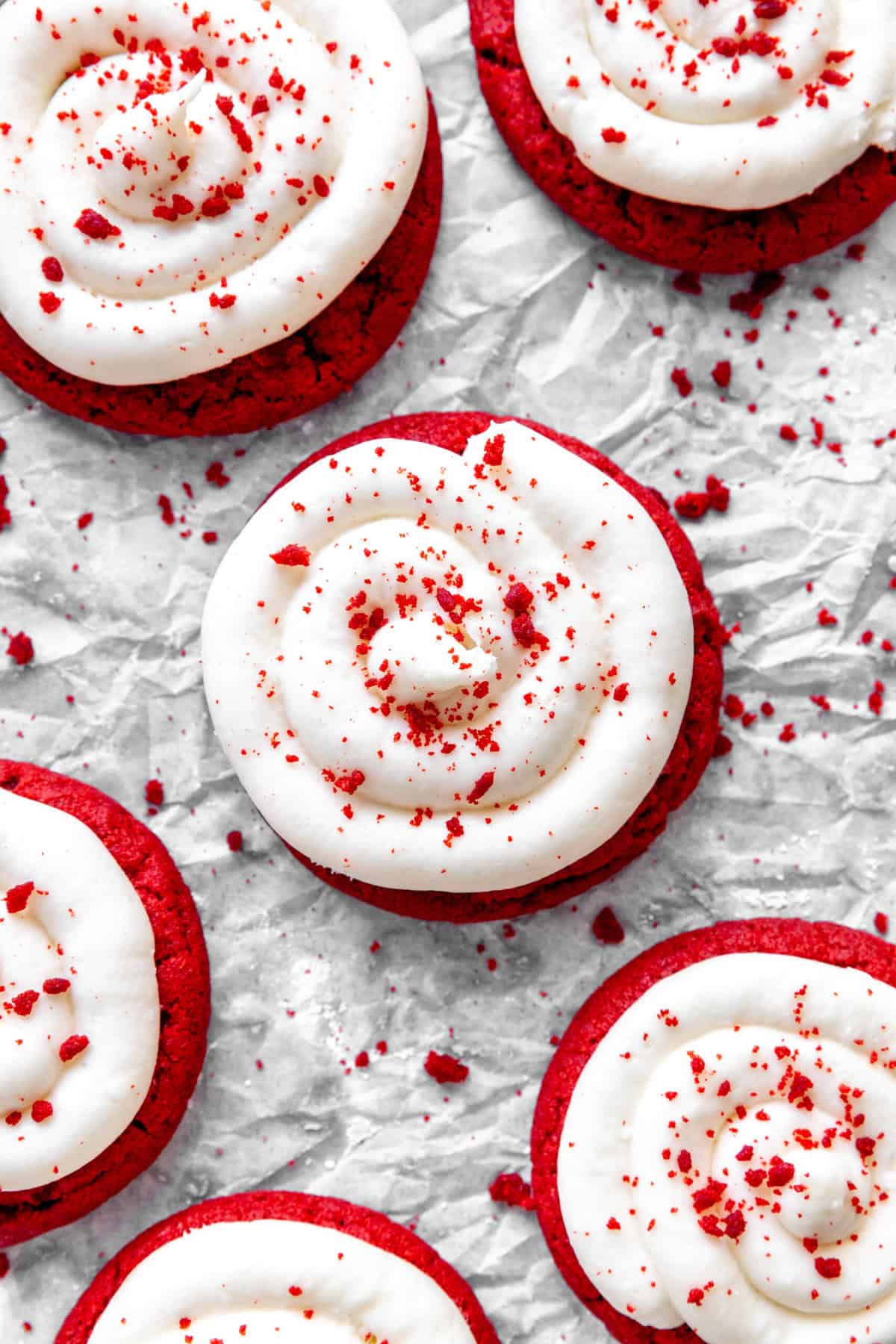 Red velvet cake cookies on white parchment paper.