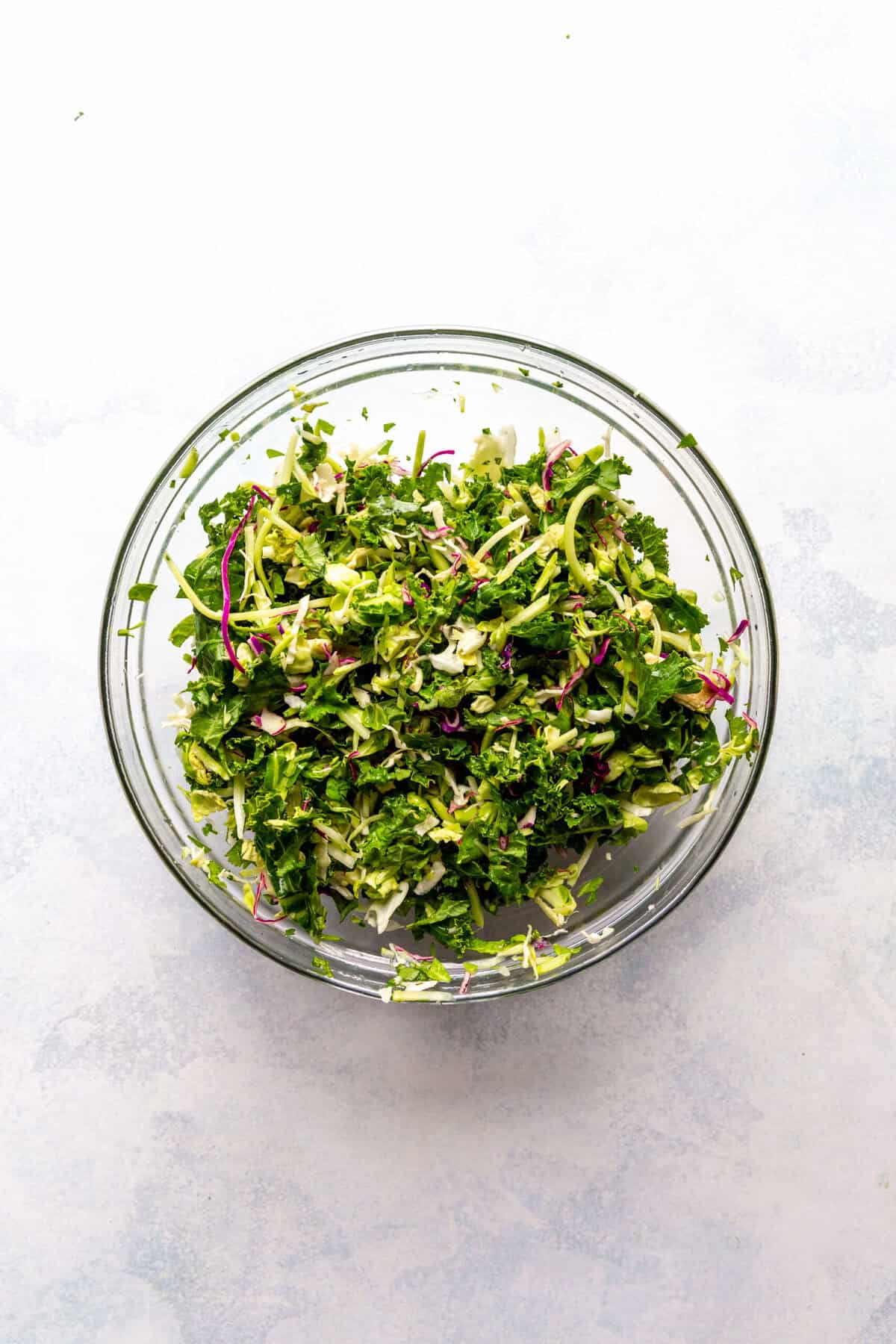 Glass bowl of cilantro slaw.