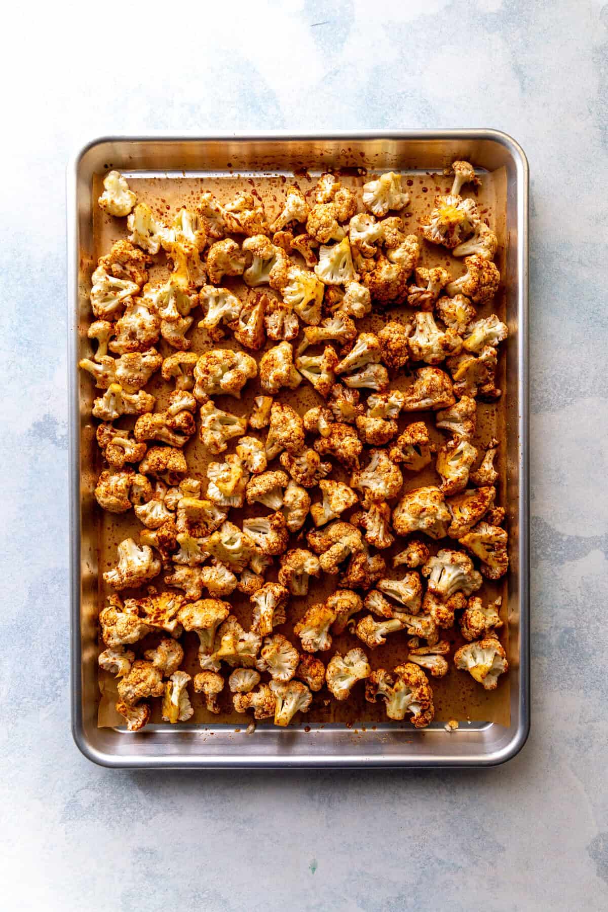 Cauliflower on a baking sheet.