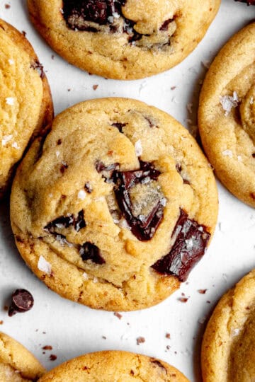 Chocolate chip cookies on a white surface.