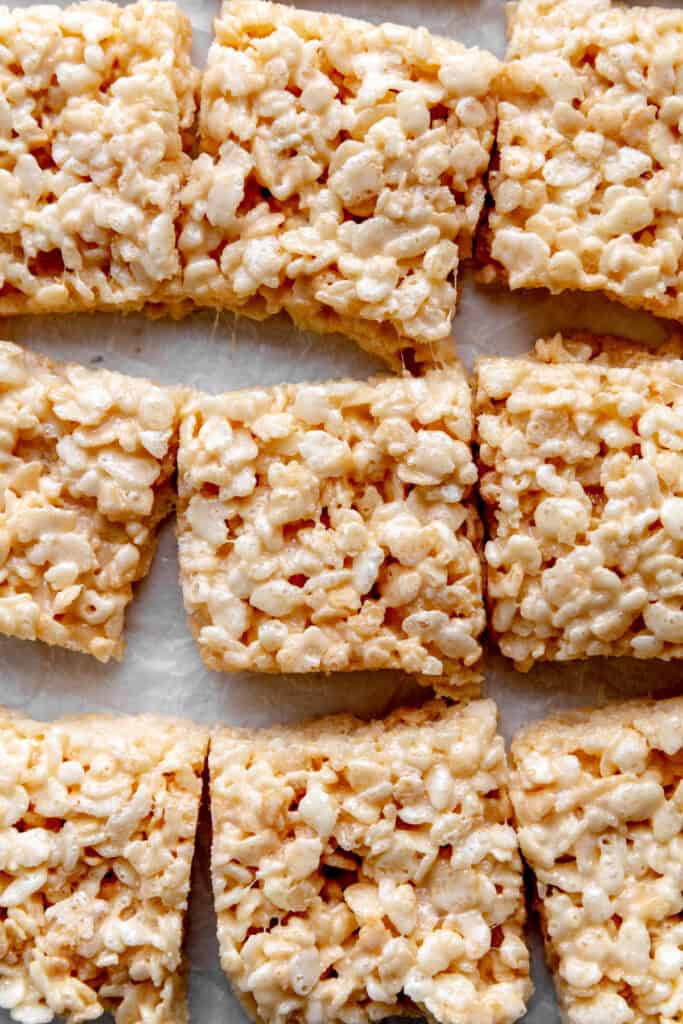 Rice krispie treats on a white surface.