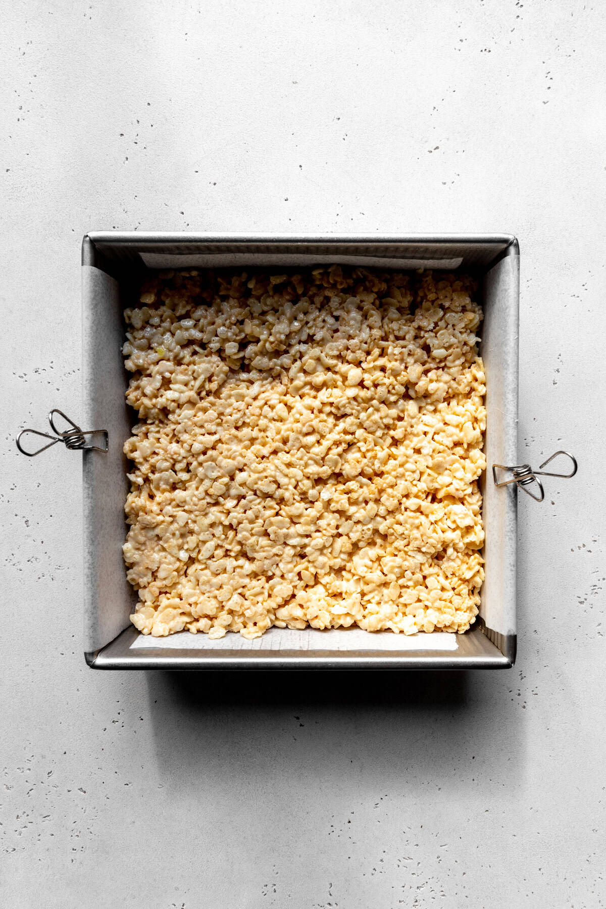 Rice krispie treats in a square pan.