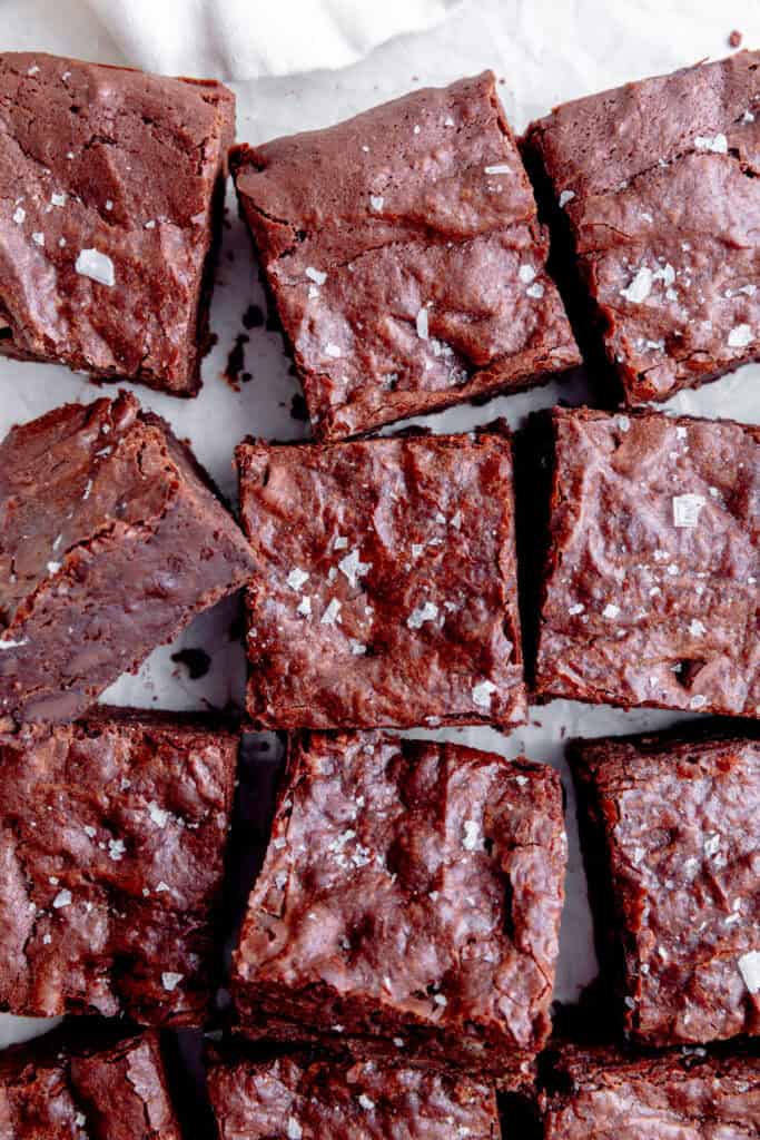 Brownies cut into squares and topped with flaky salt.