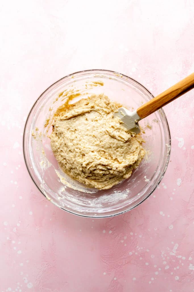 Glass bowl of donut bowl with a rubber spatula.