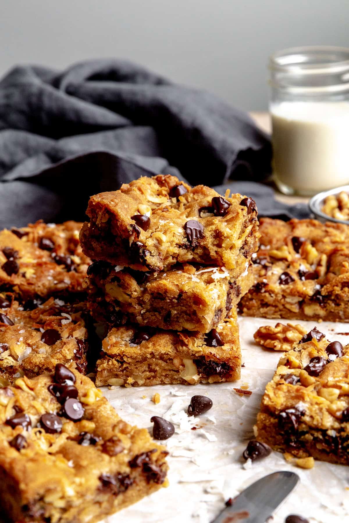 Stack of vegan blondies and a cup of milk.