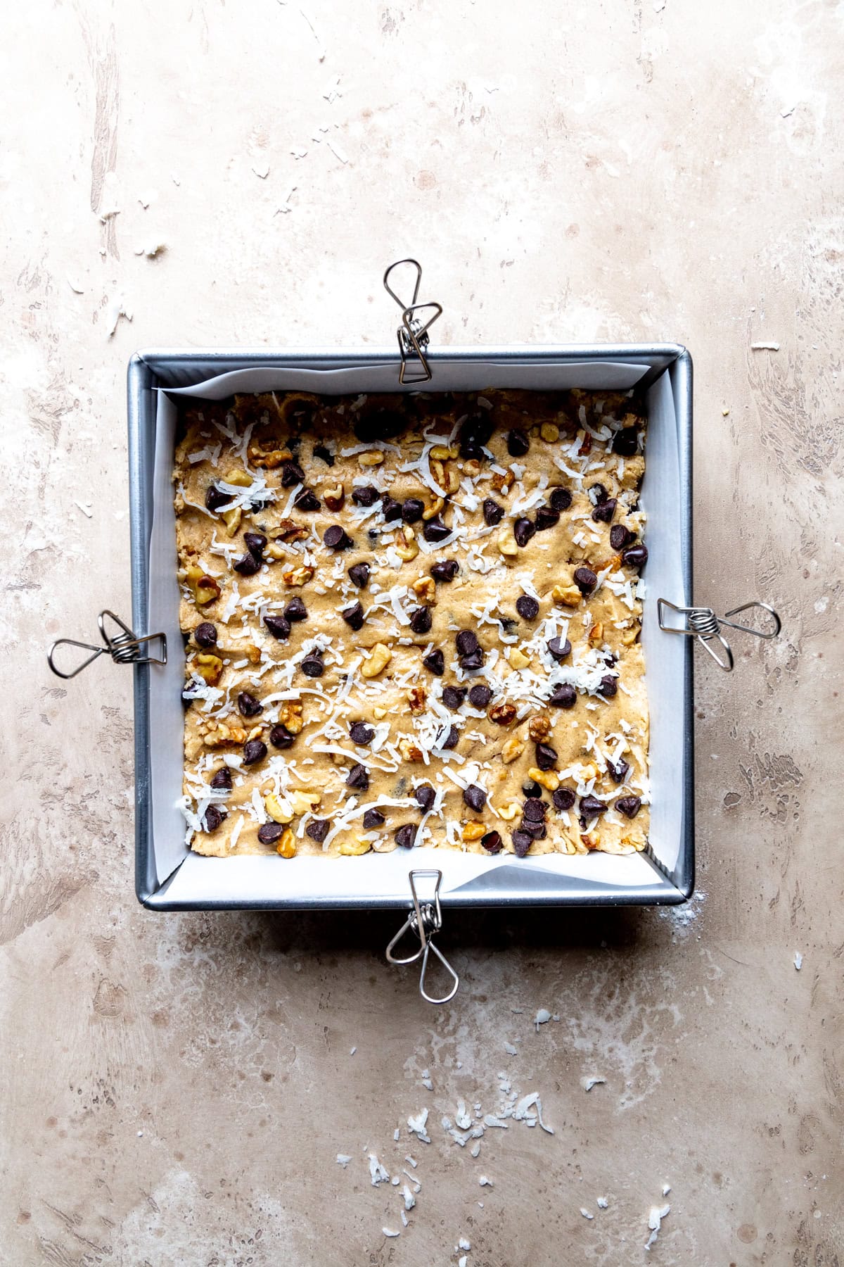Unbaked blondies in a square pan.