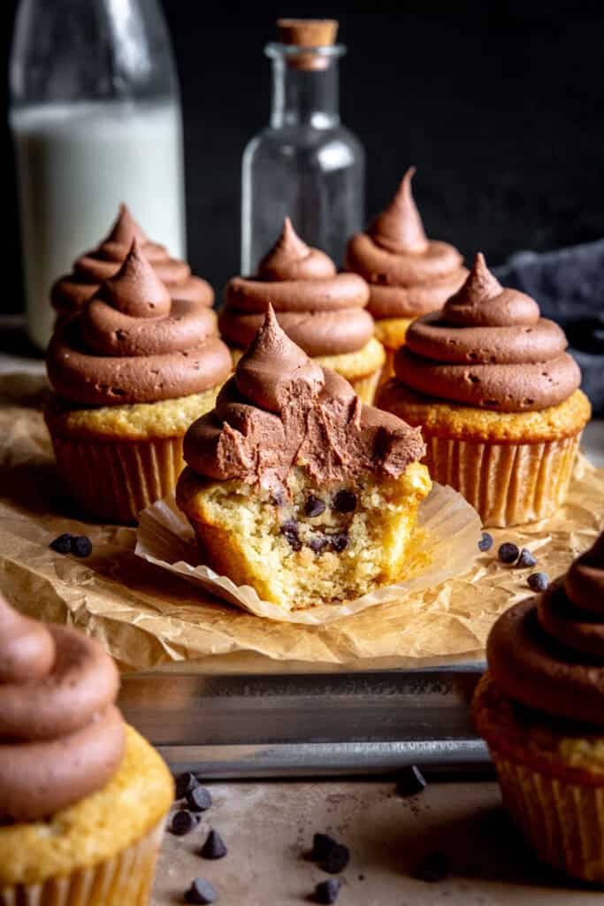 Vanilla cupcake stuffed with chocolate chip cookie dough and topped with chocolate frosting.