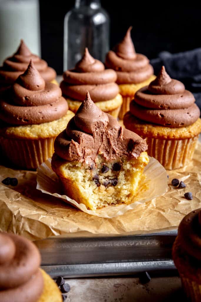 Vanilla cupcake stuffed with chocolate chip cookie dough and topped with chocolate frosting.