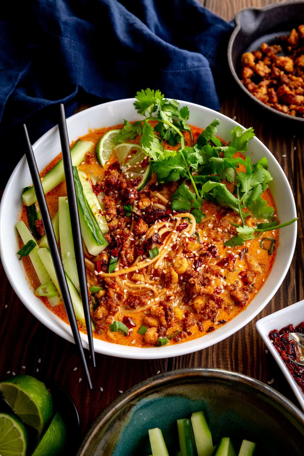 Bowl of miso curry ramen and a small skillet of crispy crumbled tofu.