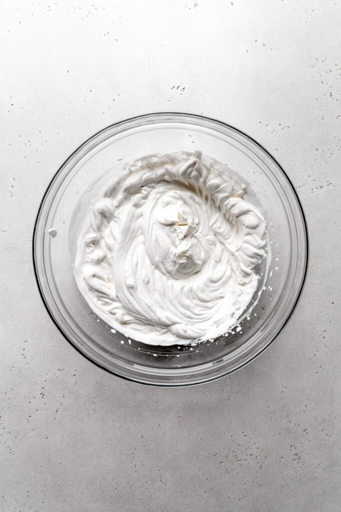 Glass bowl of whipped cream.