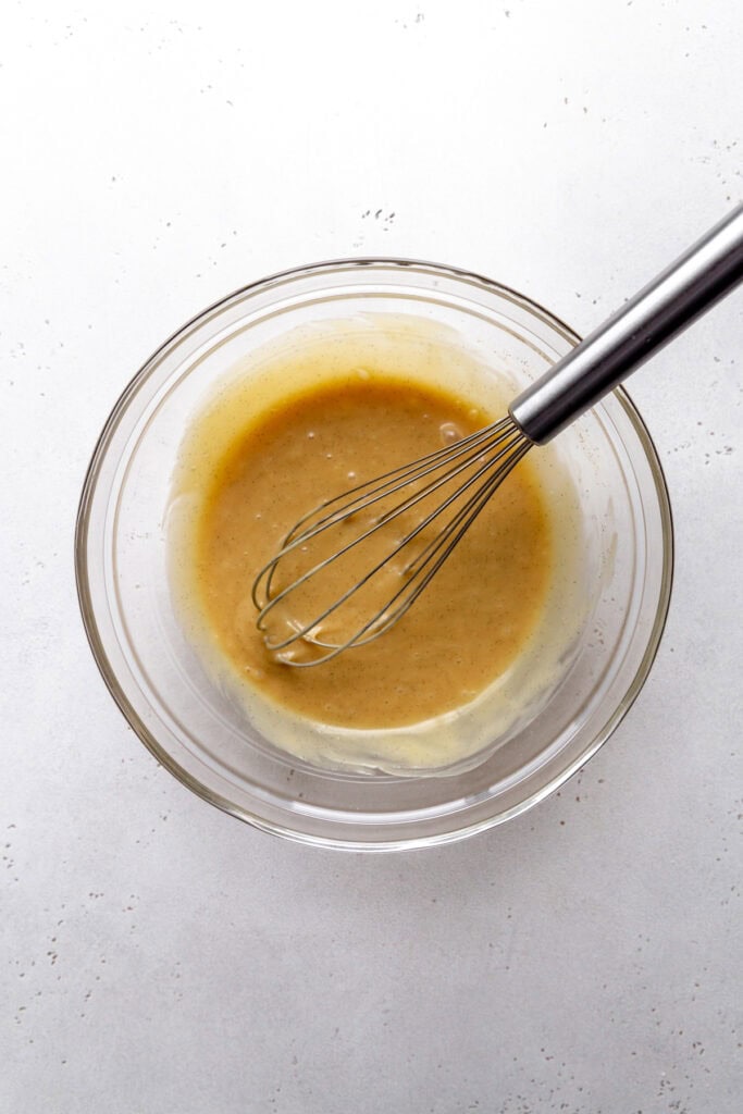 Glass bowl of dairy-free sweetened condensed milk.