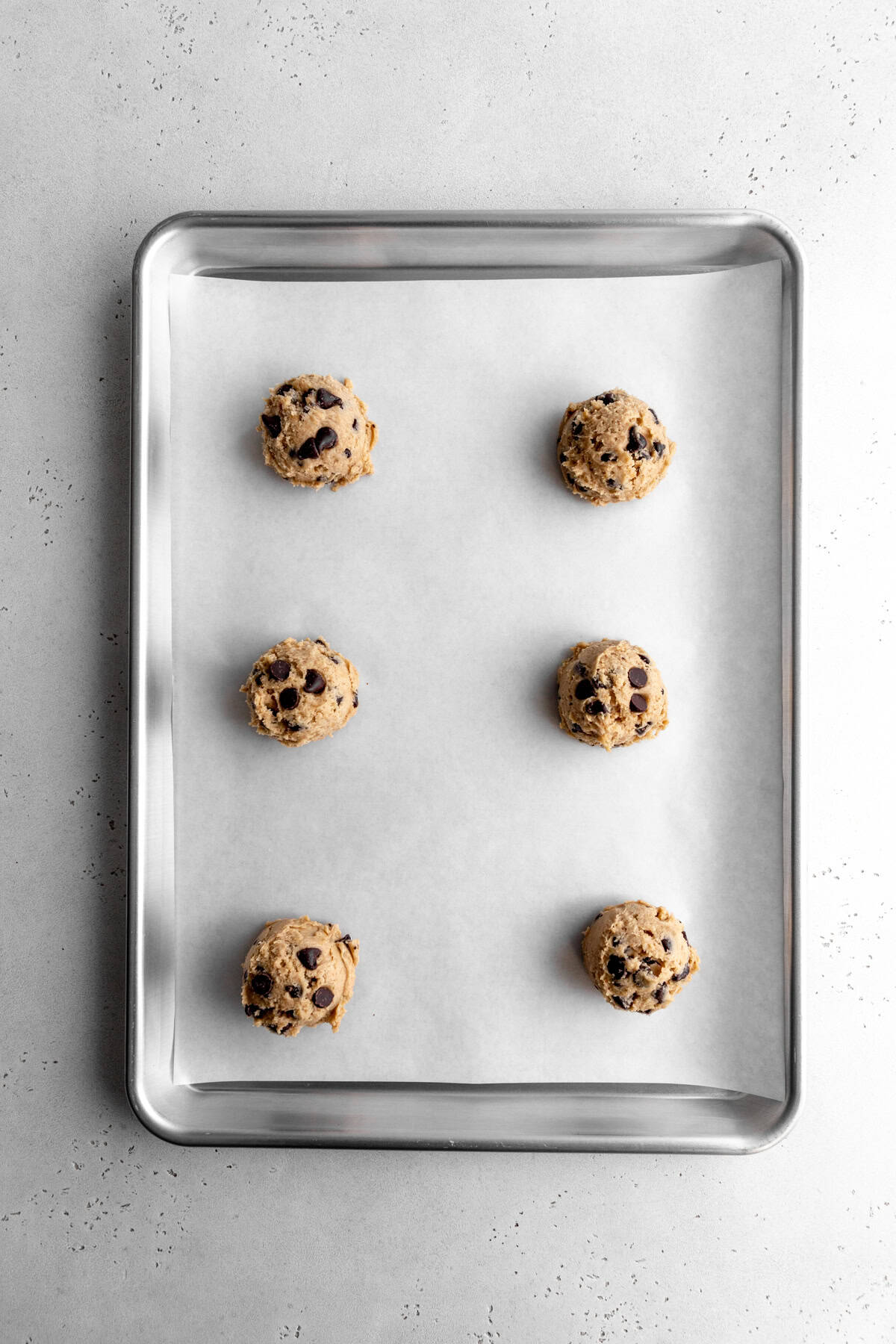 Unbaked cookie dough on a baking sheet.