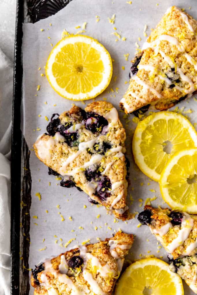 Lemon blueberry scone drizzles in lemon glaze.