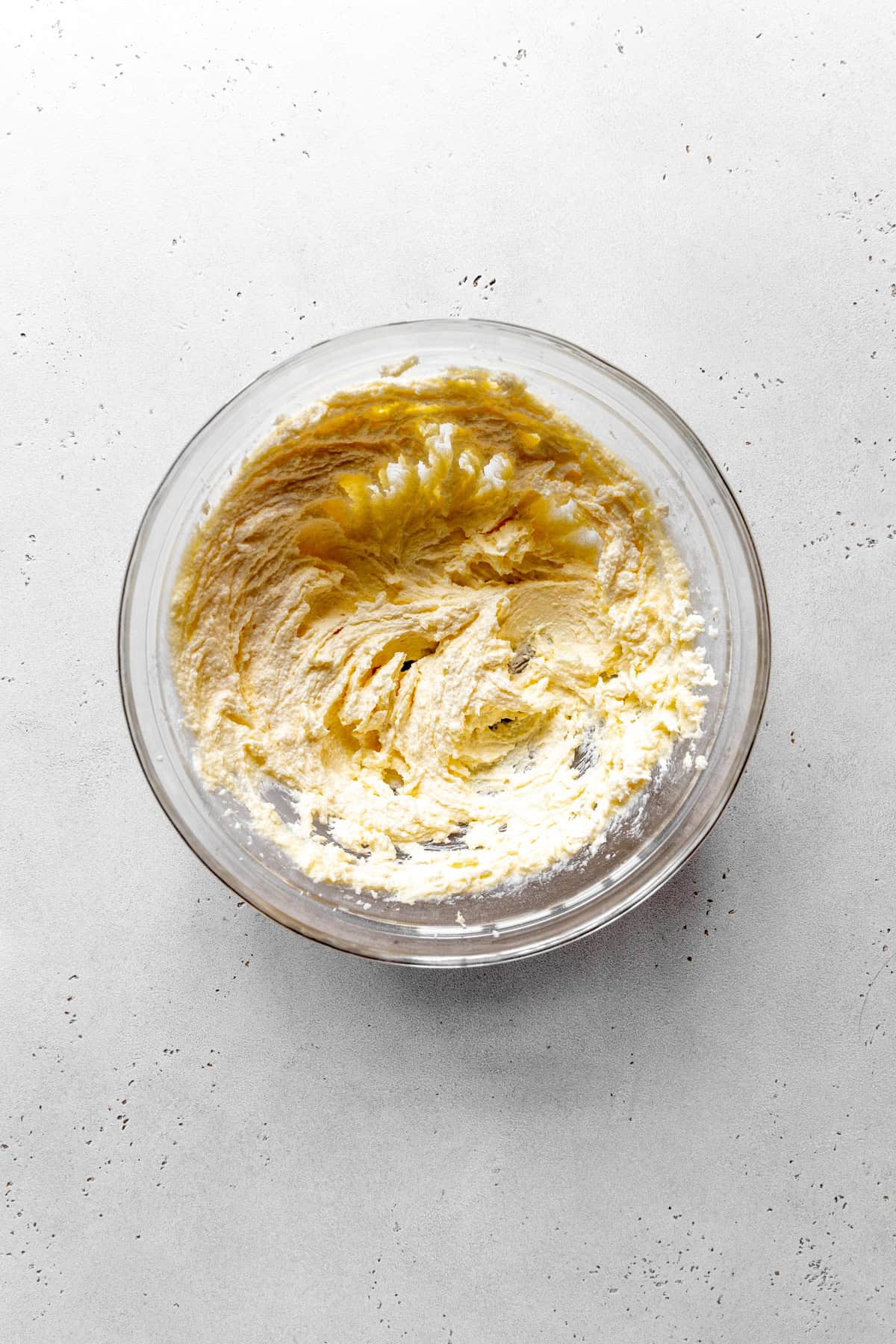 Creamed butter in a glass bowl.