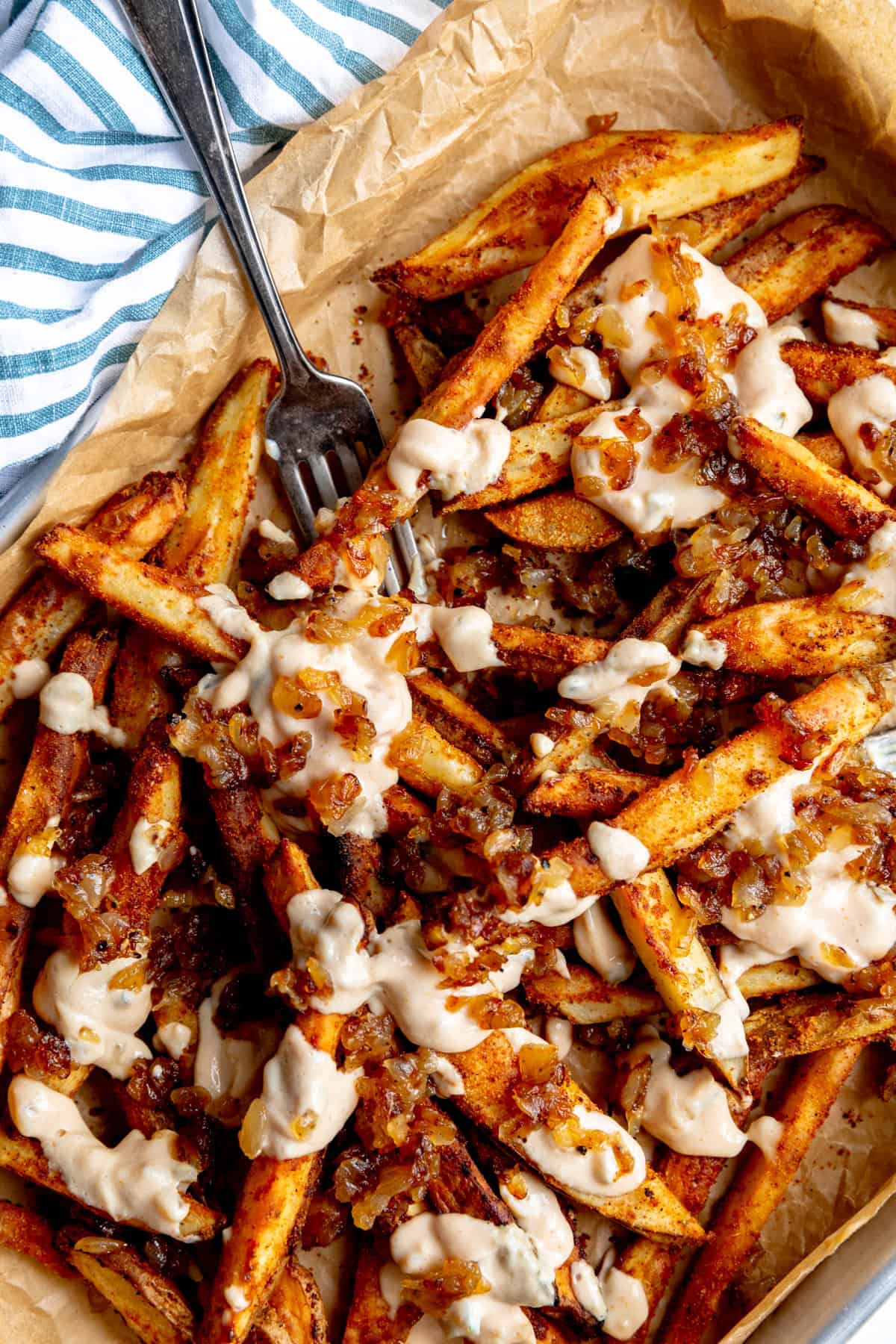Animal fries and a striped linen napkin.