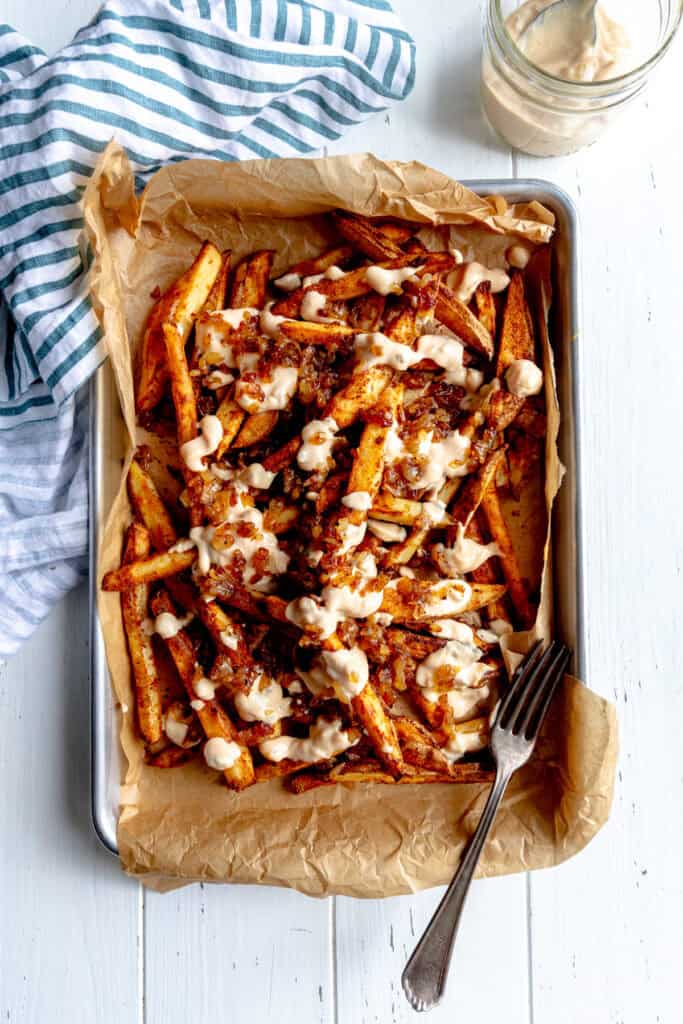 Animal fries on a baking sheet lined with parchment paper.